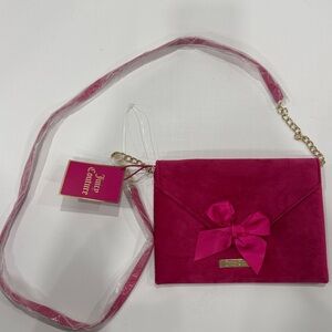 This is a hot pink velvet Juicy Couture crossbody envelope bag